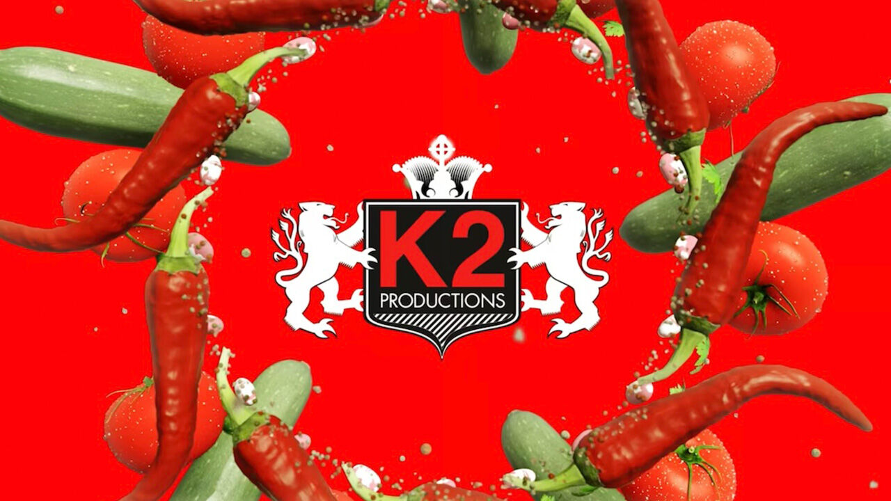 K2 Productions logo with ring of peppers, tomatoes and zucchini around it.