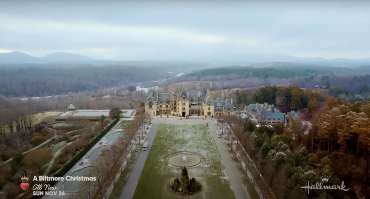 Aerial shot of Biltmore Estate with NC mountains in background