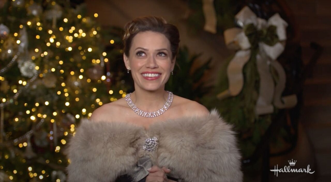 Actress from "A Biltmore Christmas" wearing fur stole and diamond necklace